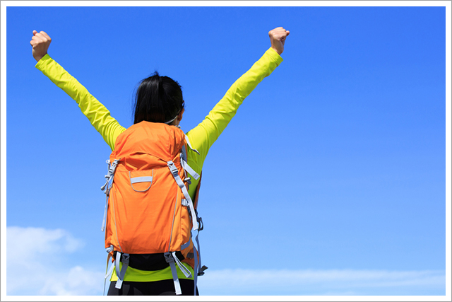 Woman hiking on a clear, blue day